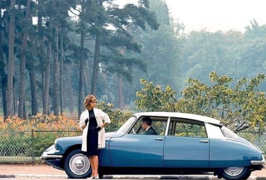 The worlds most beautiful car with a beautiful woman.