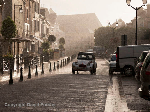 A beautiful wet, French street scene with a Classic 2CV.  Photograph by David Forster.