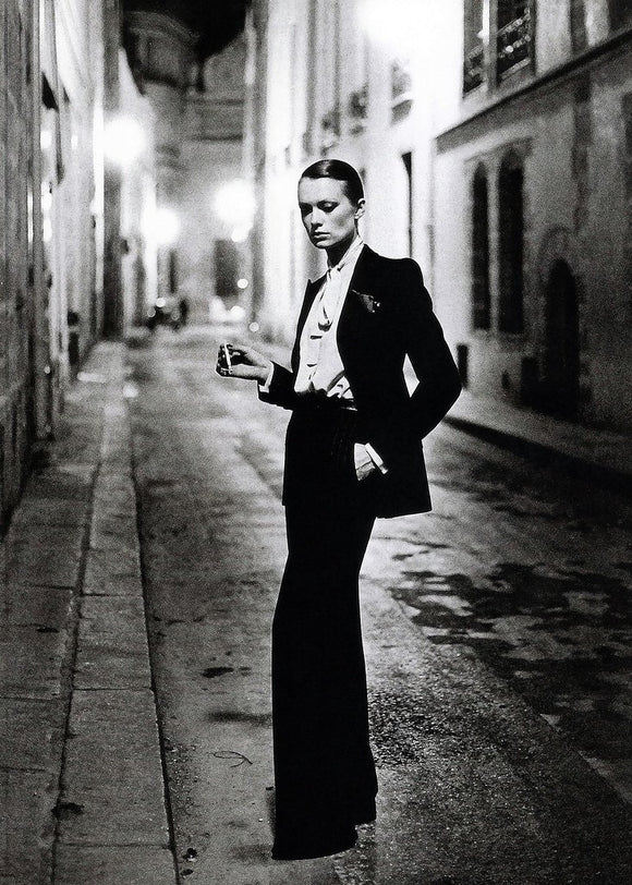 Yves Saint Laurent's 'Le Smoking' Suit (shot on Rue Aubriot) by Helmut Newton for "Paris Vogue" - 1975