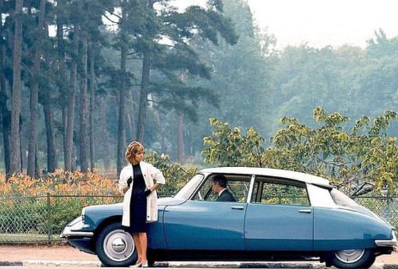 The worlds most beautiful car with a beautiful woman.